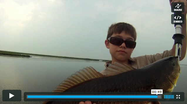 Video grab of a young boy during a fishing trip