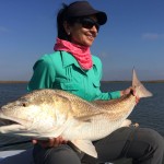 Woman is delighted after catching a fish