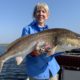 Woman enjoying flyfishing in Louisiana during late summer