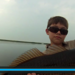 Video grab of a young boy during a fishing trip