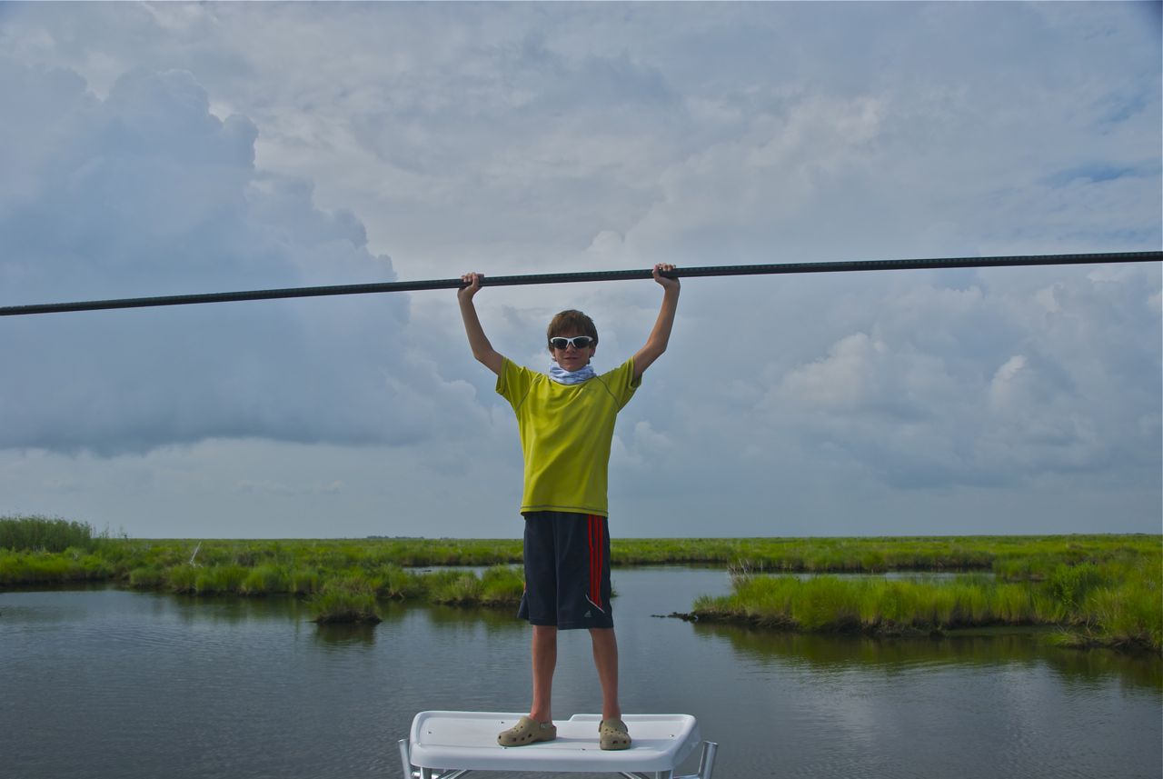 Young boy poses during a fishing trip