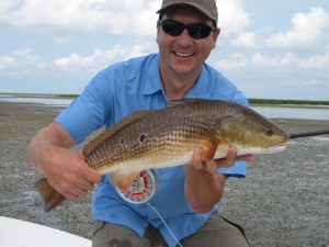 The smile of a man after catching a fish