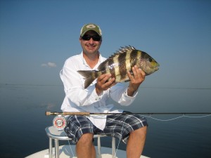 Man looks delighted showing the fish he caught