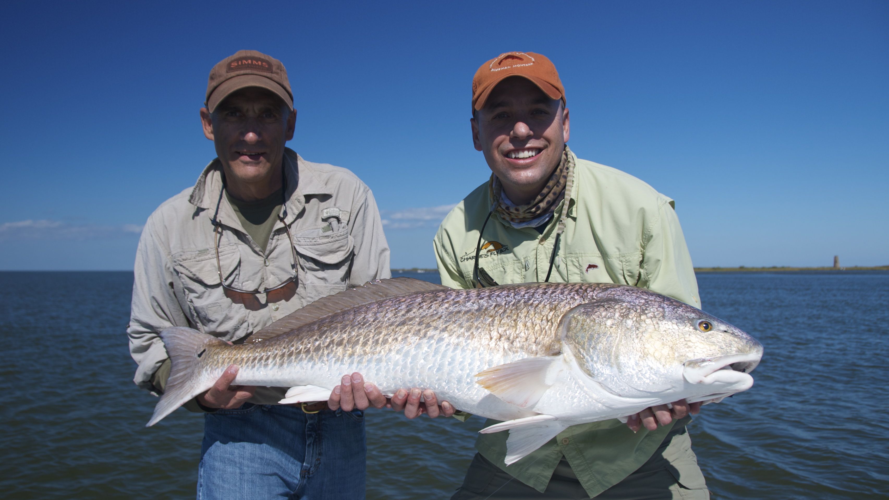 Two men celebrating a fresh catch