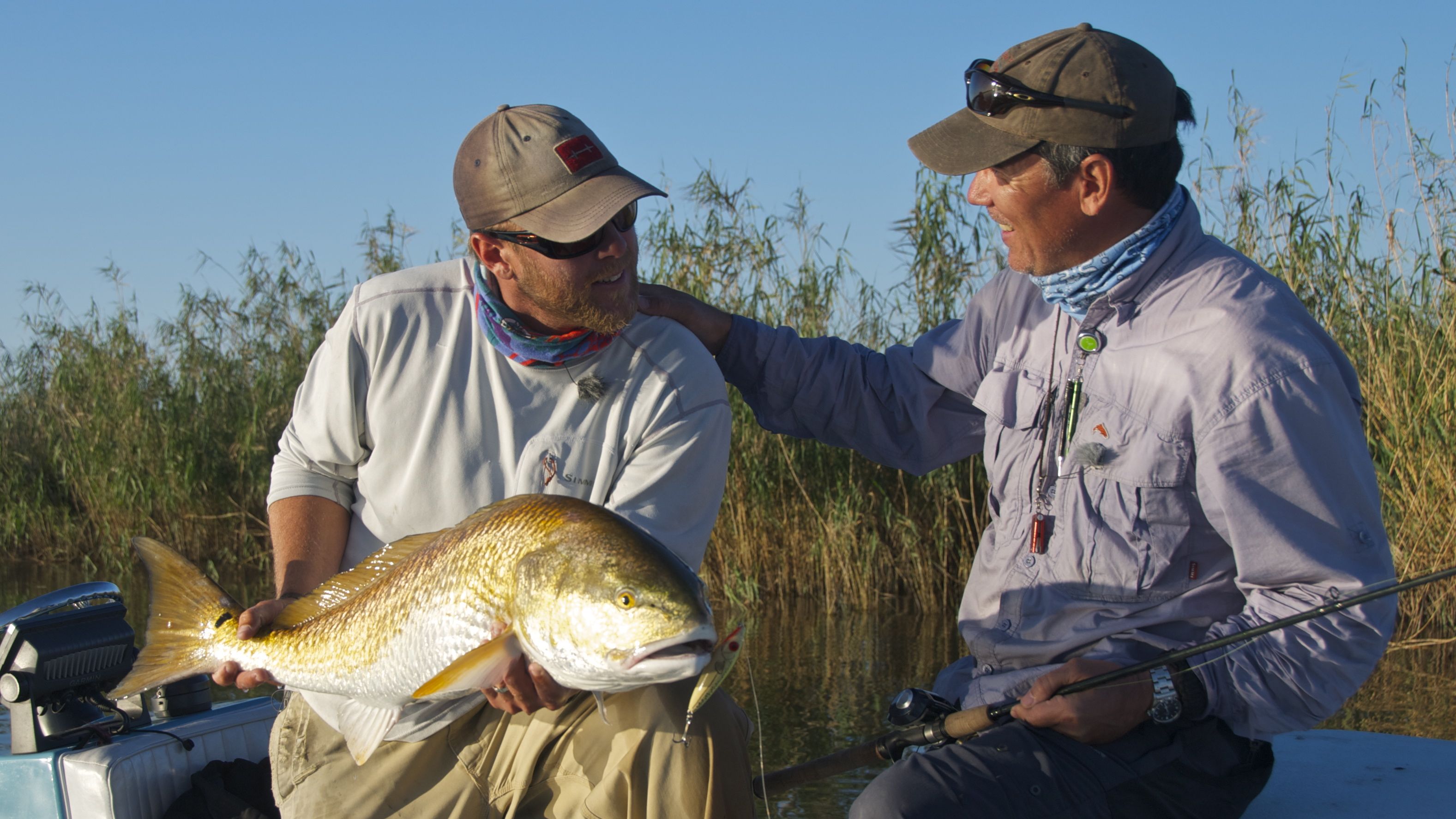 Man congratulates his partner on a good catch