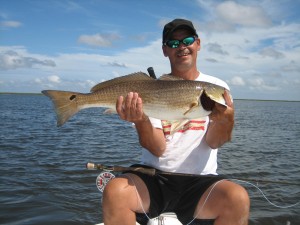 Grinning ear to ear after catching a fish