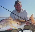 Man beams after a successful catch