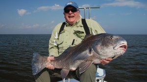 The old man is delighted after catching a fish