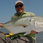 Bearded man delighted at the fish he just caught