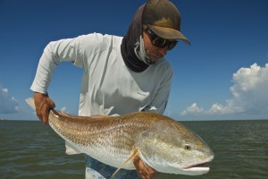 Man admires the fish he has just caught