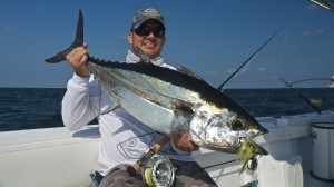 Man proudly shows the large fish he caught