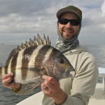 Man shows to the camera the fish he caught