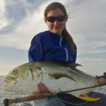 Woman is happy to pose with the fish she caught