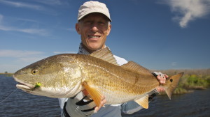 Old man is happy after catching a bass