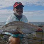 Man happily poses with his catch