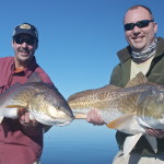 Two men are happy after fishing success