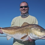 Man shows off his successful catch