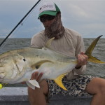 Man proudly admires the fish he caught