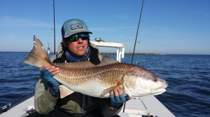 Man shows off the fish he just caught