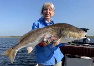 Woman enjoying flyfishing in Louisiana during late summer