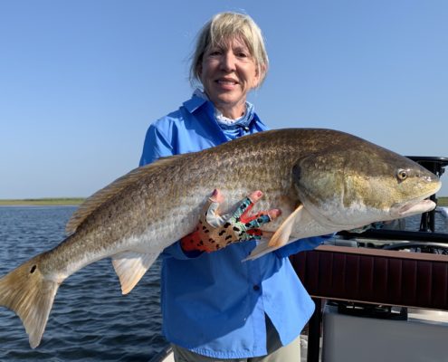 Woman enjoying flyfishing in Louisiana during late summer