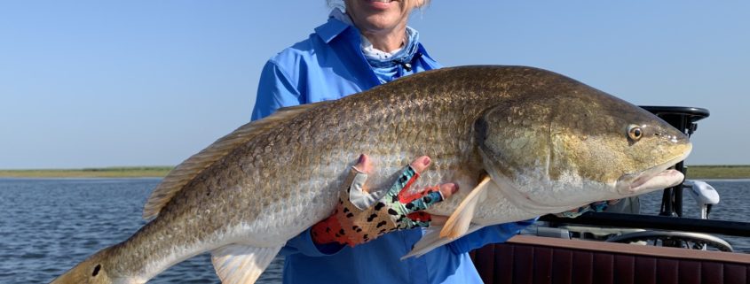 Woman enjoying flyfishing in Louisiana during late summer